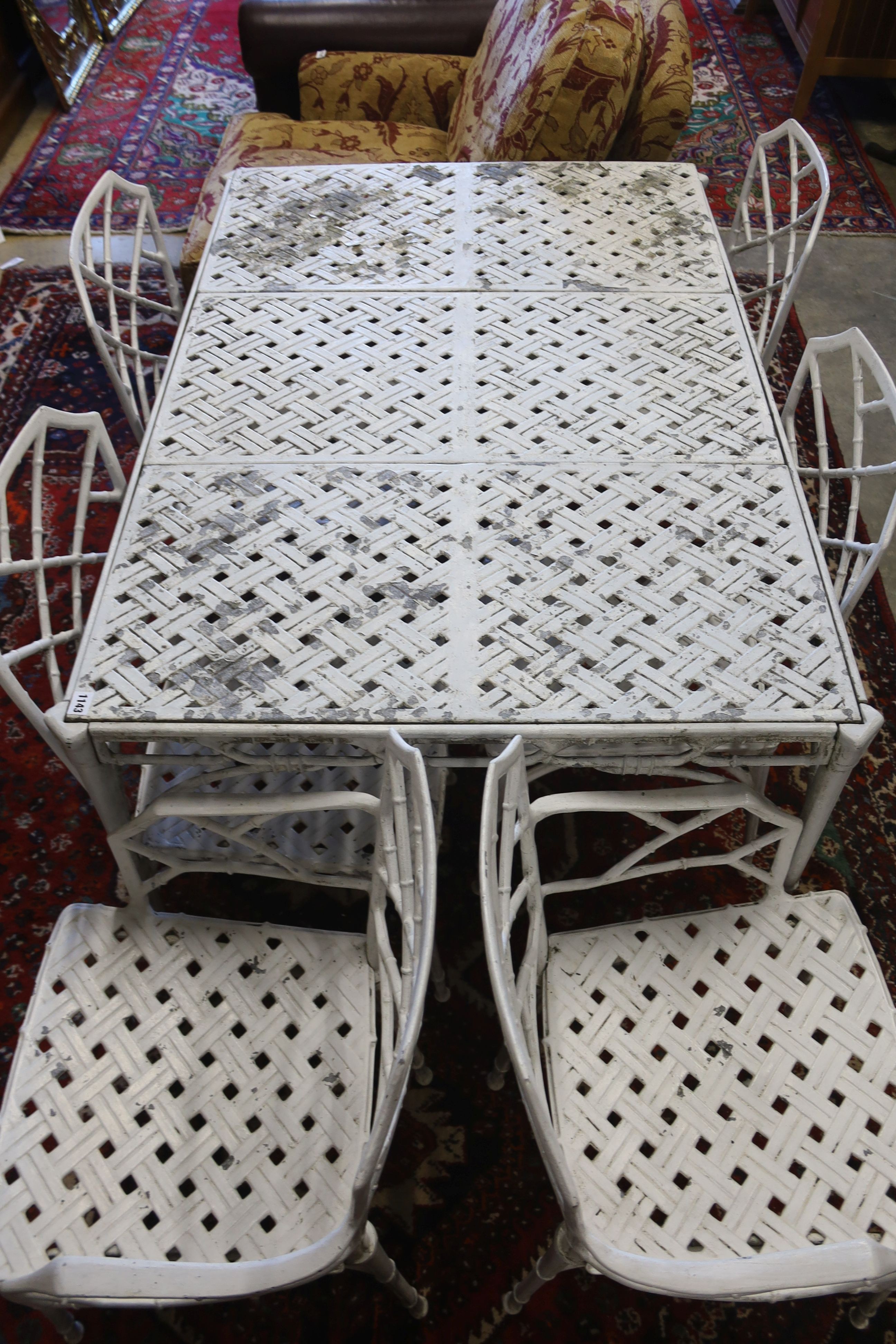 A painted aluminium faux bamboo rectangular garden table, length 130cm, depth 88cm, height 71cm and six chairs